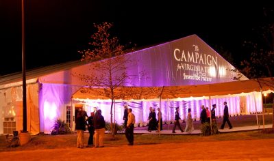 The Campaign for Virginia Tech: Invent the Future logo is projected on the tent where the closing celebration was held.