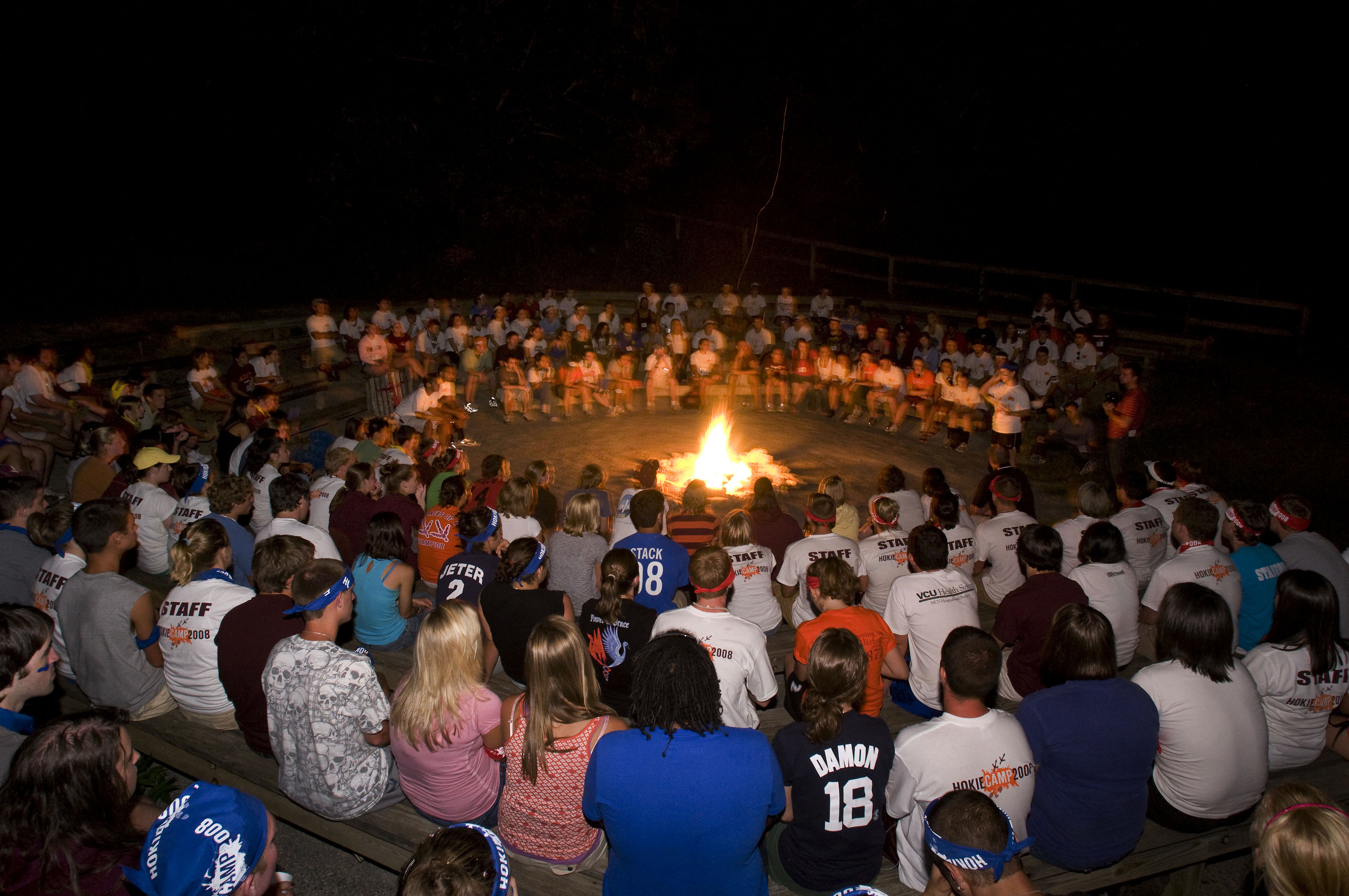 Hokie Campers sit around camp fire