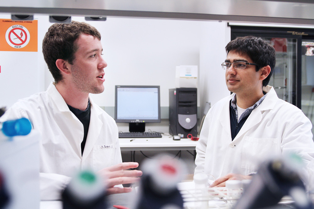 Student Kelly Drews and professor Shiv Kale at work in the laboratory.