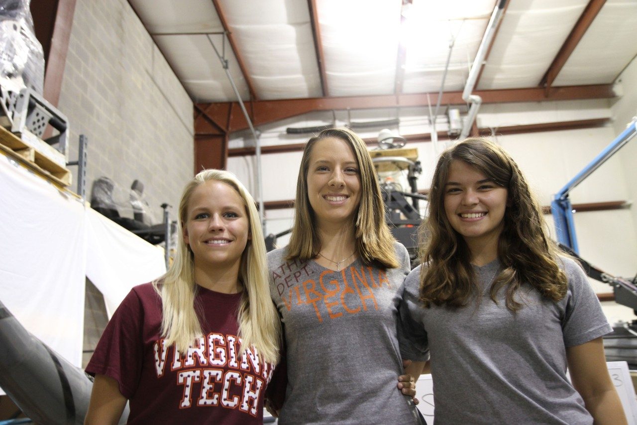 Alisha Konst and Robin Roston, both rising juniors in mechanical engineering at Virginia Tech, and Alison Brown, a rising sophomore in electrical engineering at Virginia Western Community College, meet at Virginia Tech's Center for Vehicle Systems and Safety Lab. 
