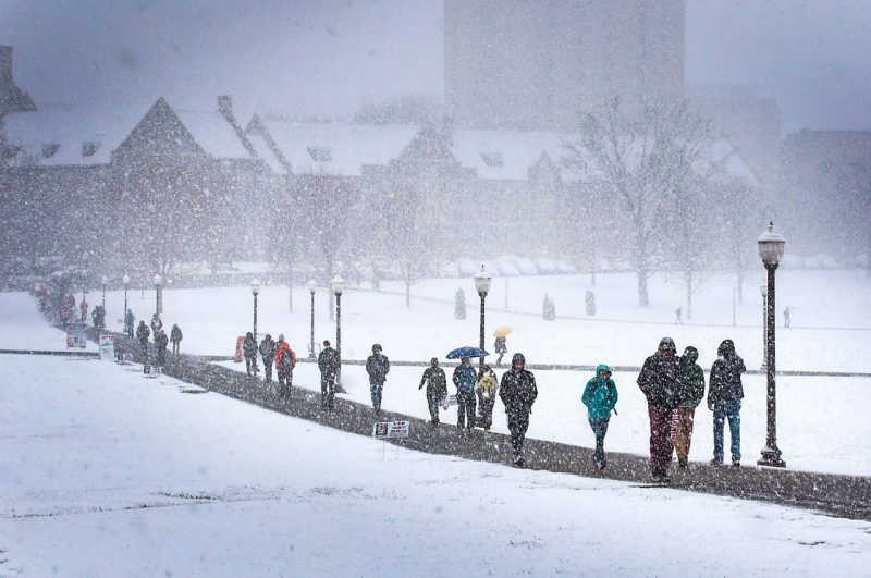 A snowy day for students walking to classes on the Drillfield.