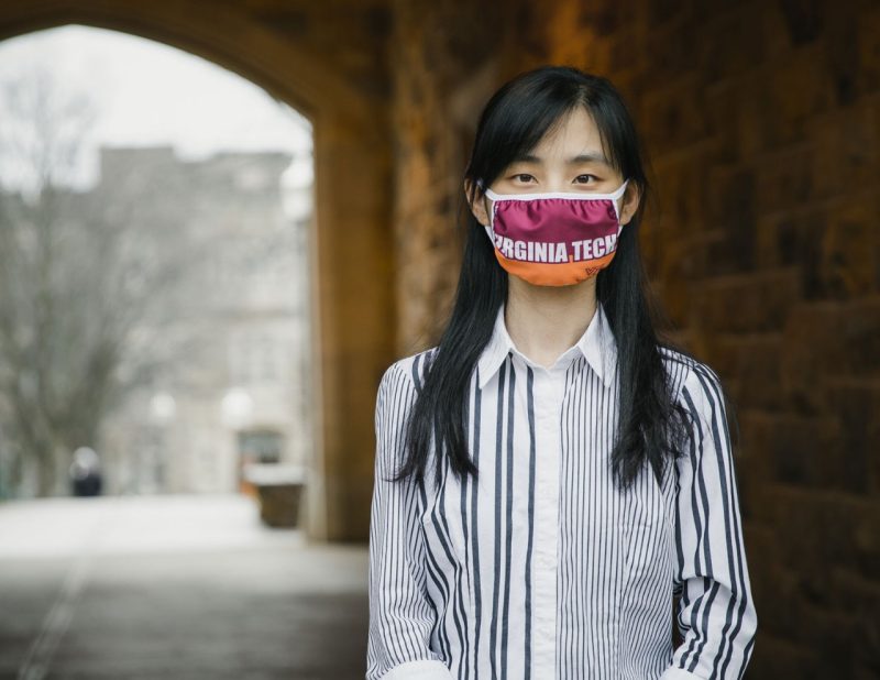 Portrait of Lisha Yuan, doctoral Engineering Mechanics student in BEAM, wearing a Virginia Tech mask