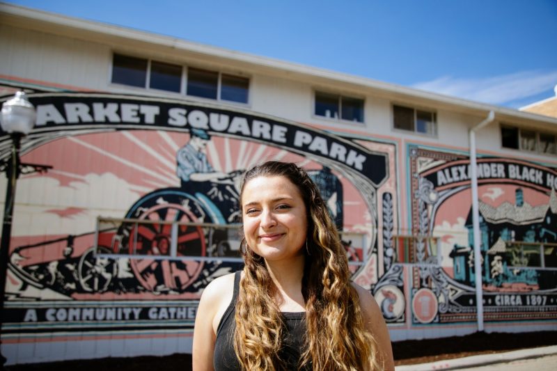 Lauren Provinsal, class of 2022 outstanding senior in the College of Agriculture and Life Sciences and majoring in Human Nutrition, Foods, and Exercise, poses at the Blacksburg Farmers Market where she has been a volunteer since her freshman year. (Photo by Christina Franusich/Virginia Tech)