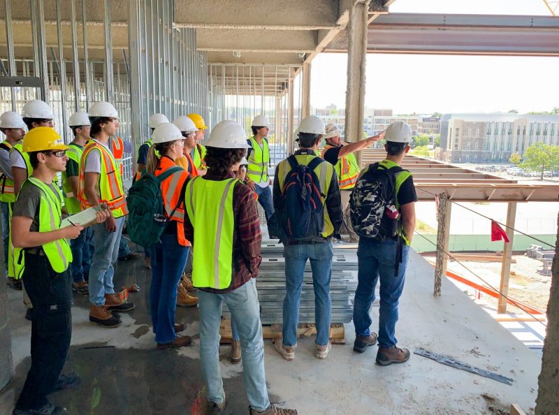 A class of Myers-Lawson School of Construction students conduct a site visit on the Virginia Tech campus.