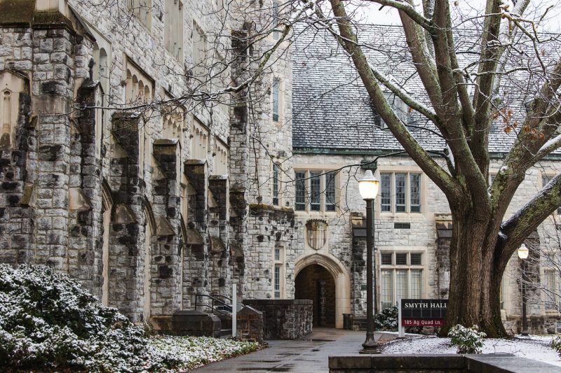 Image shows a light dusting of snow on green places next to Smyth Hall