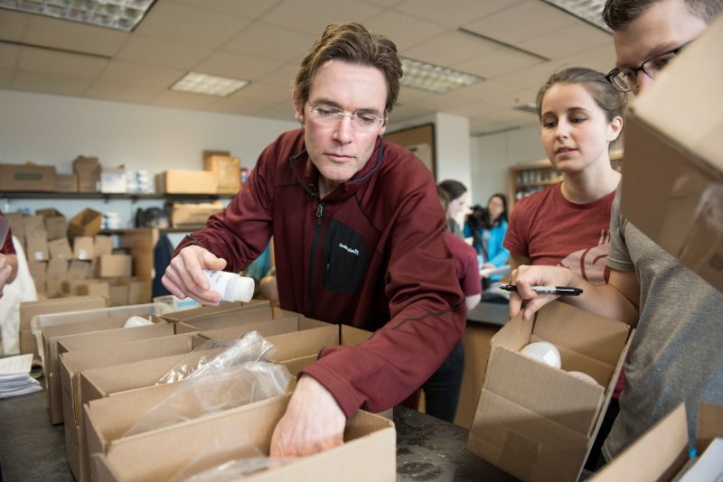 Professor Marc Edwards checks water test kits with his student team