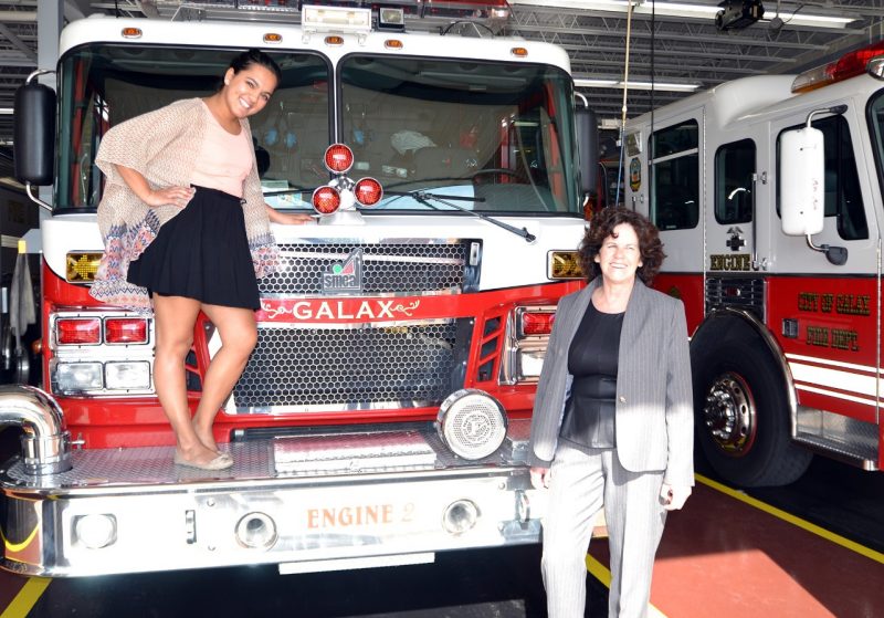 Hannah Samlall, a senior, with Brenda Marrah, a grant writer, with fire truck in Galax, Virginia.