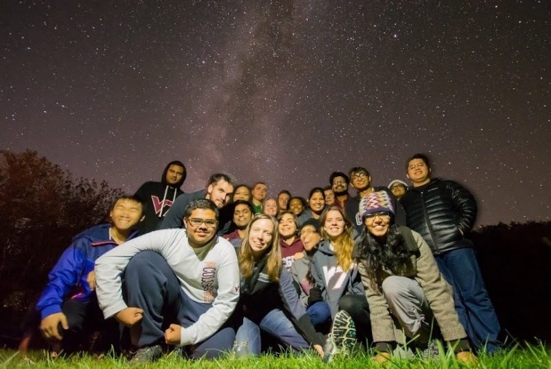 International and domestic students gather under a starry sky.