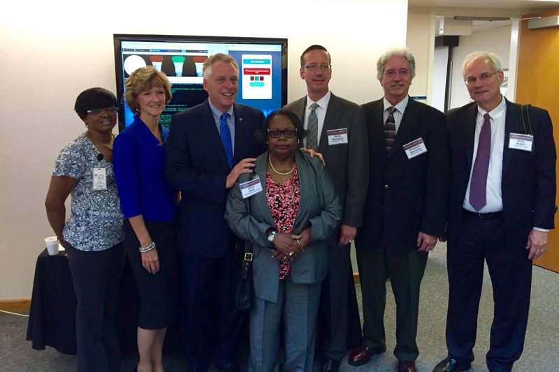 Members of the Cyber Range committee with Gov. Terry McAuliffe