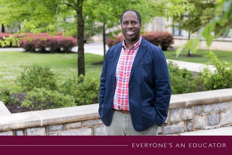 Posed image of Byron Hughes on Virginia Tech's campus, with "Everyone's an Educator" banner