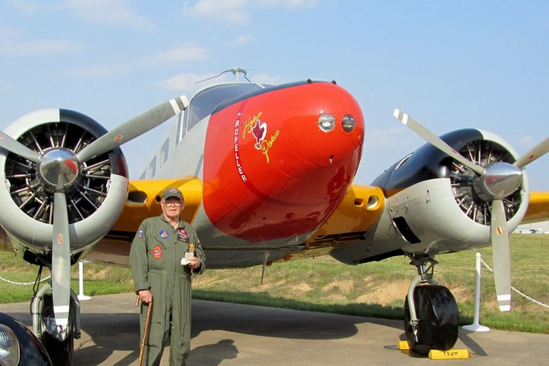 The late Stan Cohen, who was a Virginia Tech Corps of Cadets alumnus, stands with the the Tri-State Warbird Museum's C-45 "Hokie Pokie."
