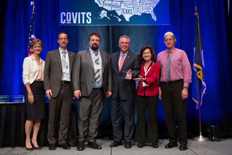 Virginia Governor Terry McAuliffe and Secretary of Technology Karen Jackson present an award to Virginia Cyber Range team members.