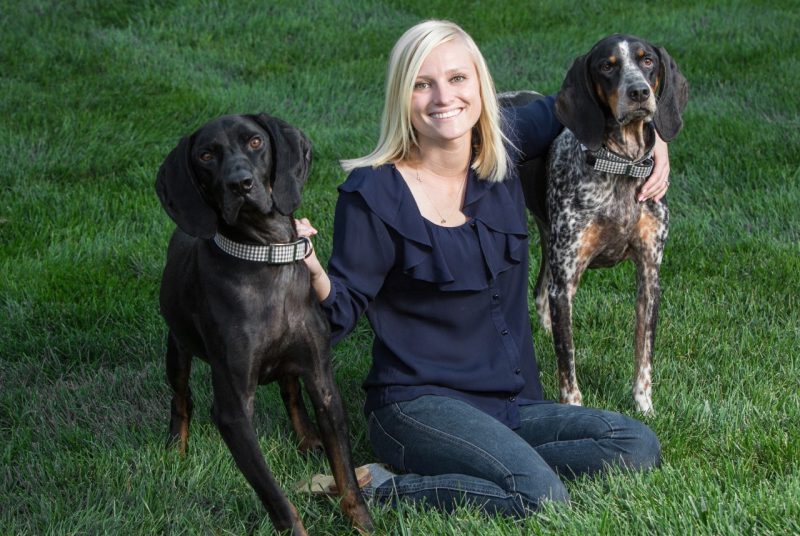 Caroline Murphy of Woofies plays with two dogs.