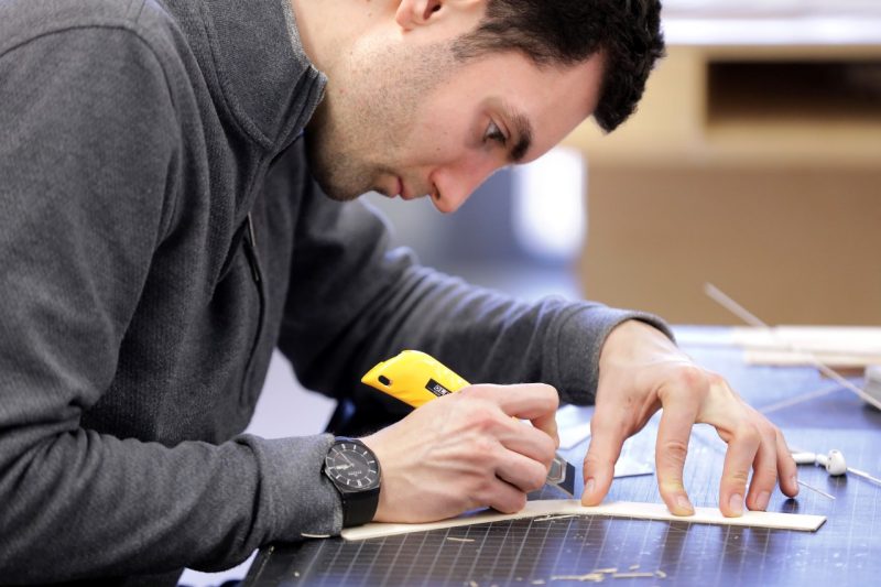 Martin Angst, an architecture graduate student, works on designs for Mzuzu University's library.