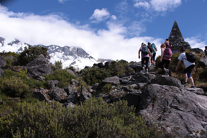 Students climbing a mountain during study abroad program.