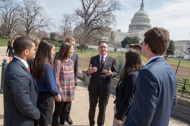 Historic Day President Sands speaks to a group of students in front of the Capitol dome.