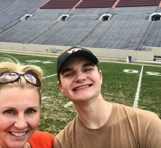 Cameron Pociask is an official Class of 2023, pictured here with his mom, Jen, at Lane Stadium during Hokie Focus.
