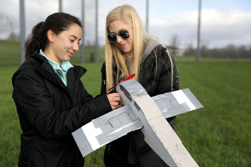 Students in an engineering education course with a homemade drone