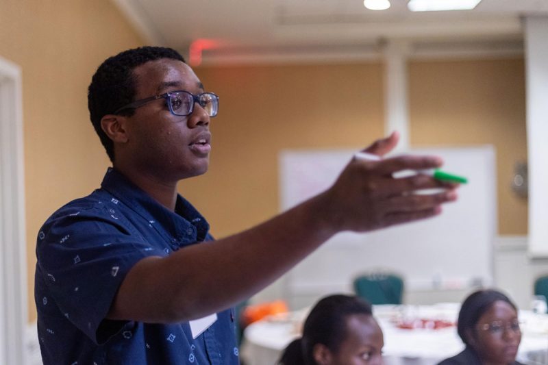 A student raises a point during a workshop discussion at the Black Alumni Summit.