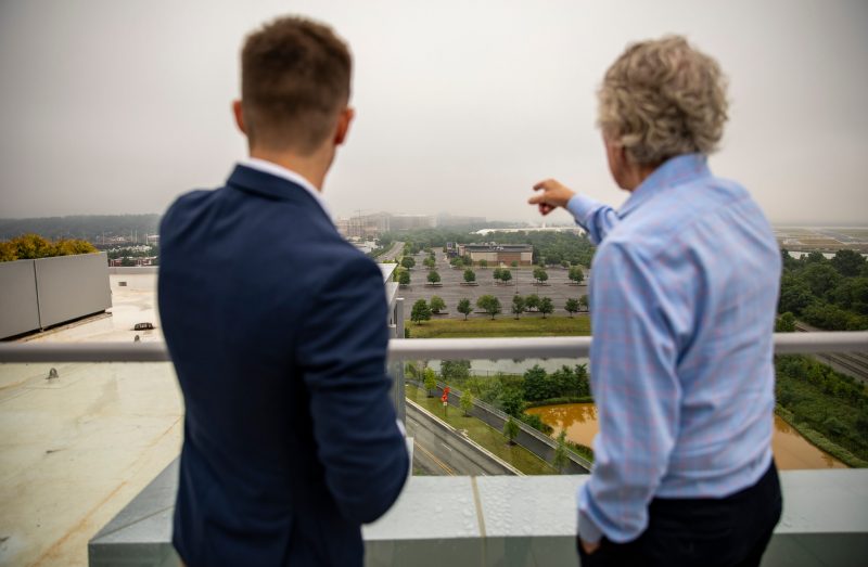 Two men look at the site of the Innovation Campus