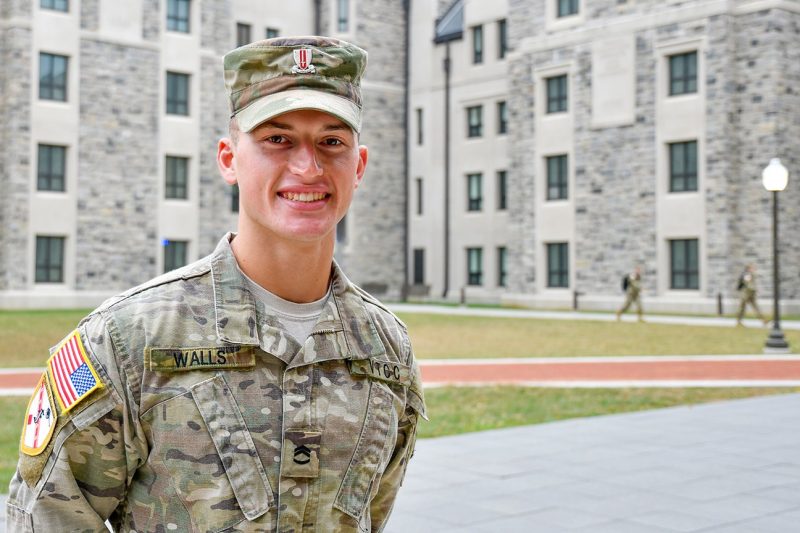 Cadet Ladson Walls stands in front of New Cadet Hall.