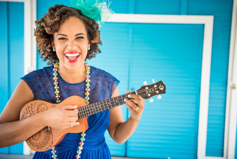 Singer and performer Jazzy Ash poses with a ukulele. 