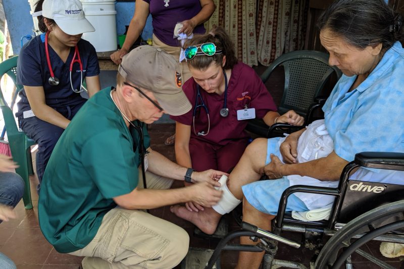 treating a patient on a medical mission trip in El Salvador