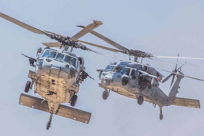MH-60S Knighthawks Two MH-60S Knighthawk aircraft fly.
