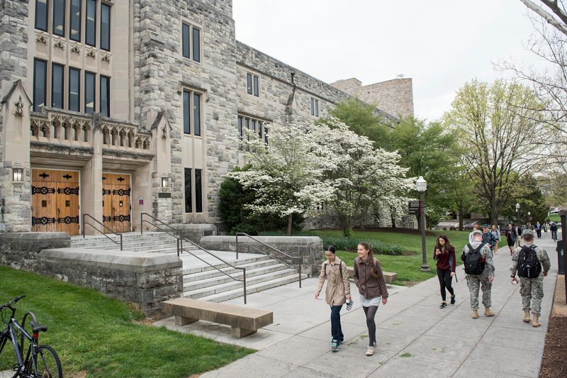 Students walking on campus near Newman Library