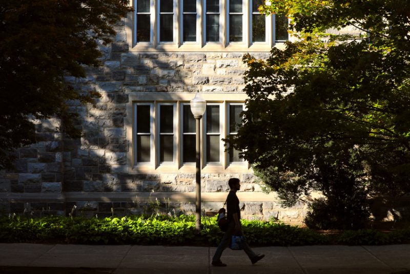 Walking in front of Pamplin Hall