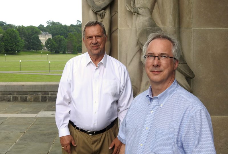 Terry Herdman and Kevin Shinpaugh of Advanced Research Computing at Virginia Tech stand outside in front of the Pylons