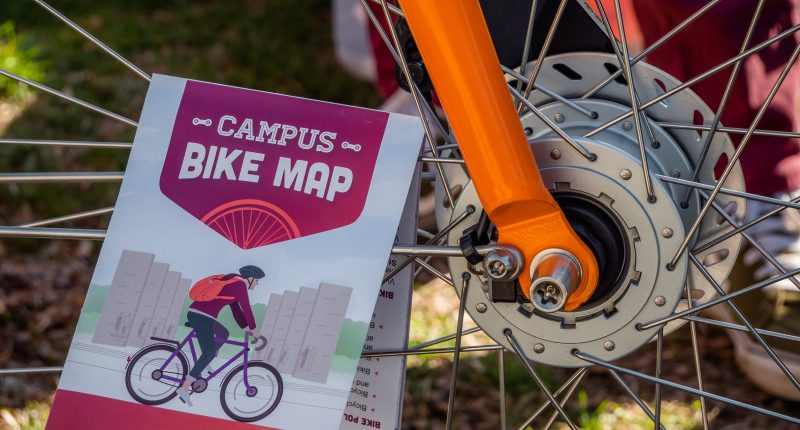 Campus Bike Map resting on a bike spoke
