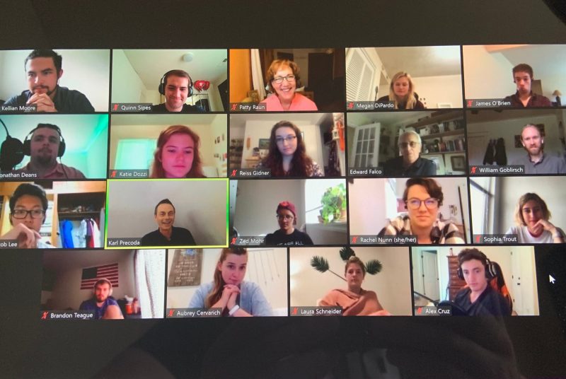 Computer screen filled with pictures of people on a Zoom call