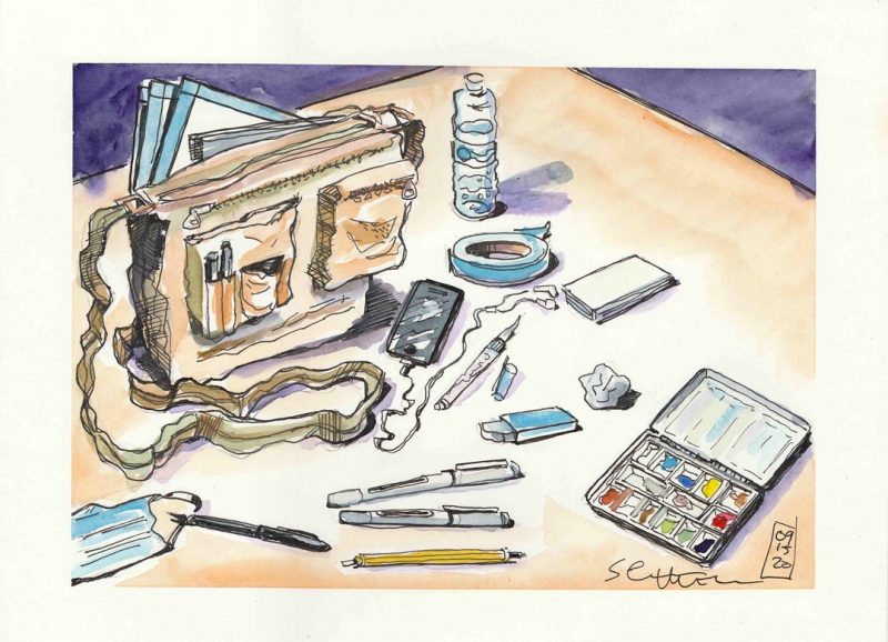 Clockwise: Messenger bag, bristol board with taped edges, water, painter's tape, index cards, kneading eraser, white polymer eraser, tin watercolor palette, Uniball Vision Extra Fine, Uniball Vision Micro, Lead Holder, Pentel Pocket Brush pen, mask, headphones, niji waterbrush