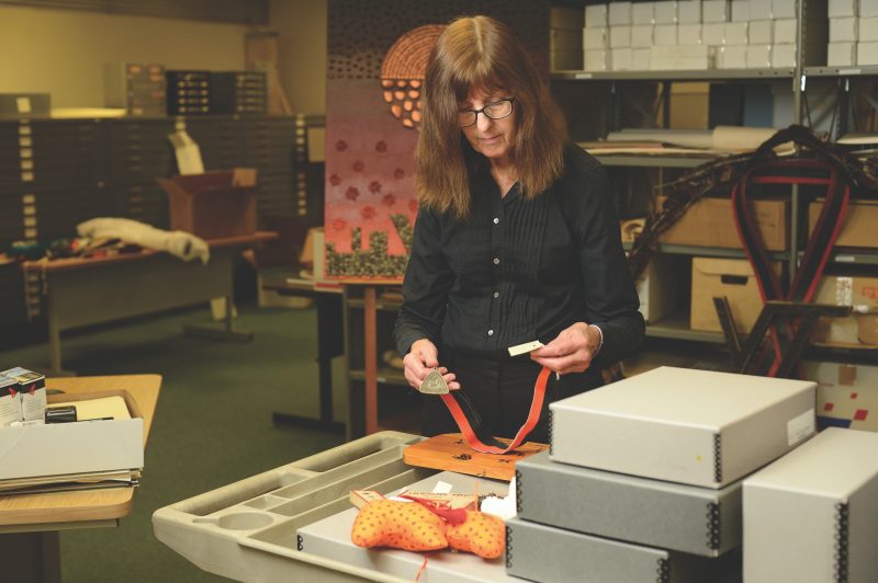 Tamara Kennelly is shown working in the University Libraries' Special Collections and University Archives.