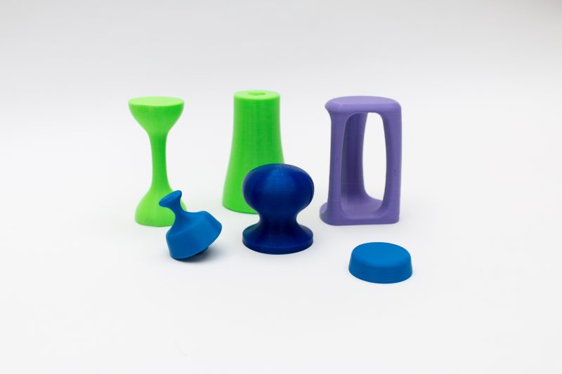 The bright green, purple and blue hand-held therapy objects in the SARAH system can be 3D printed to control costs. 