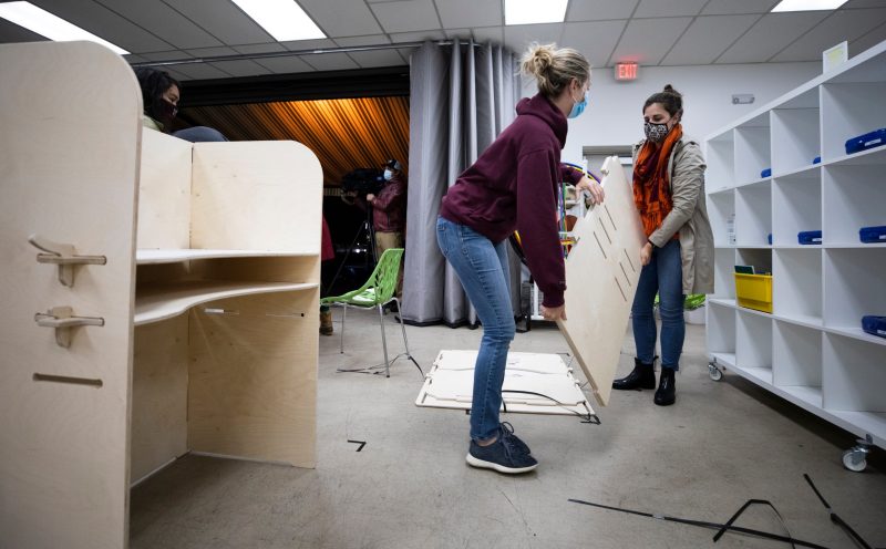 Virginia Tech alumni volunteers help deliver desk materials to Casa Chirilagua, a nonprofit community organization in Alexandria. The desks are donated to the center and to students for use in their homes. Photo by Erin Williams for Virginia Tech.