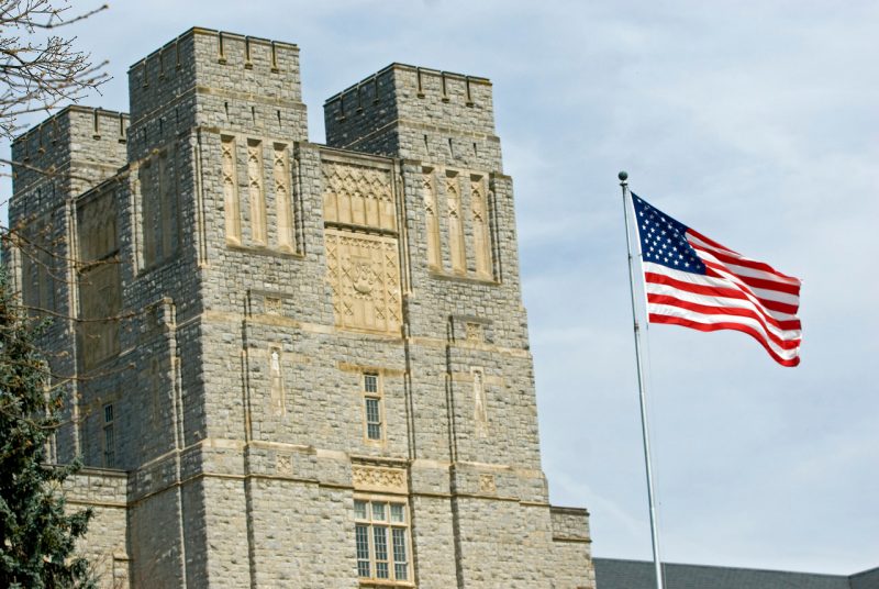 American flag in front of Burruss Hall