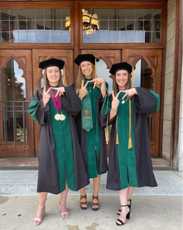 Colleen Bannigan, Marie Johnston, and Tara Feehan posing before their VCOM graduation