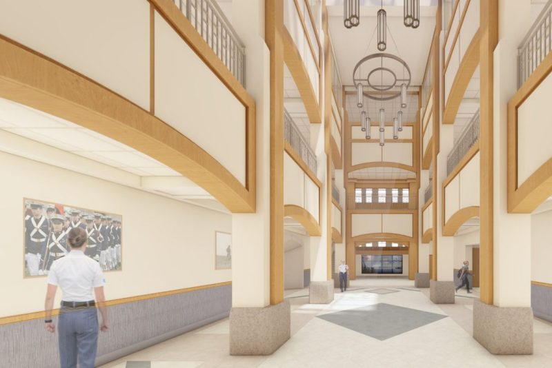 An artist's rendering of the Corps Leadership and Military Science Building shows a long hallway and a three-story atrium.