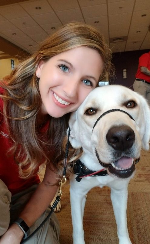 Cassie Krause close-up with a dog