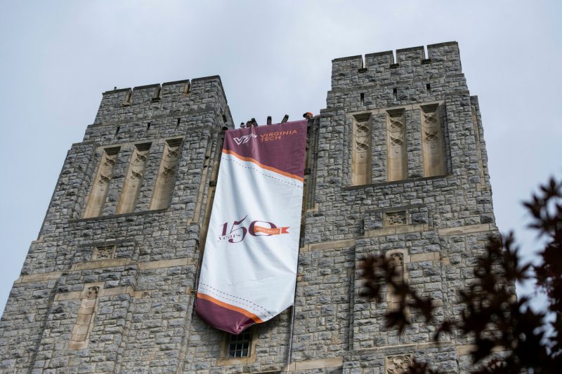 A banner on Burruss Hall was placed to announce the start of the university's 150th celebration. 