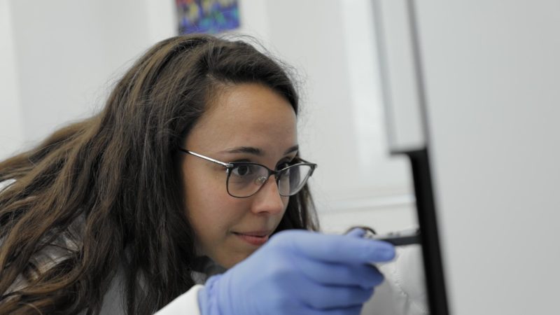 Cora Carman Esparza, doctoral student in biomedical engineering, working in lab