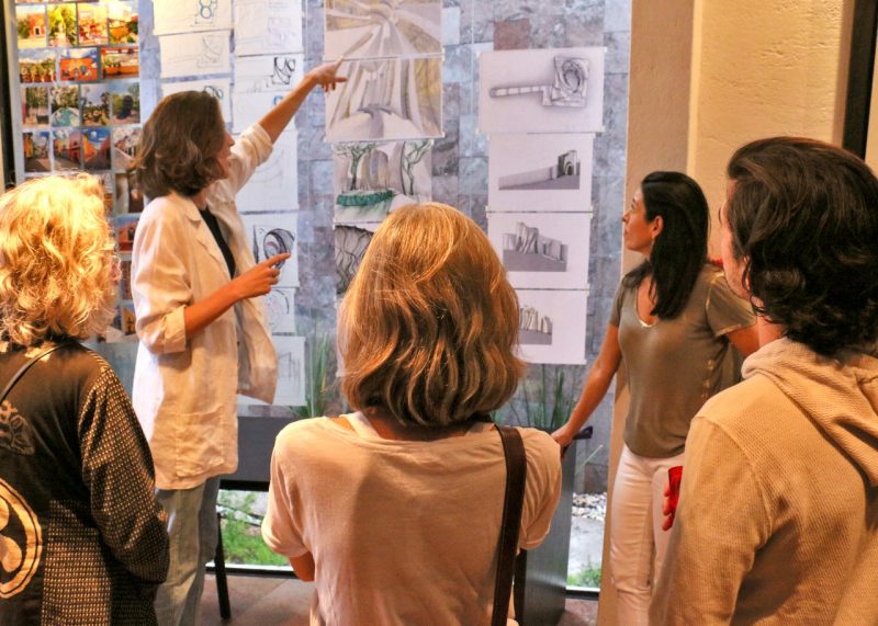 Landscape architecture student, Olivia Haag, explains her design for a community chapel on a dense urban lot in San Miguel de Allende, Mexico to artists, writers, and architects during the CASA Celebration gathering.