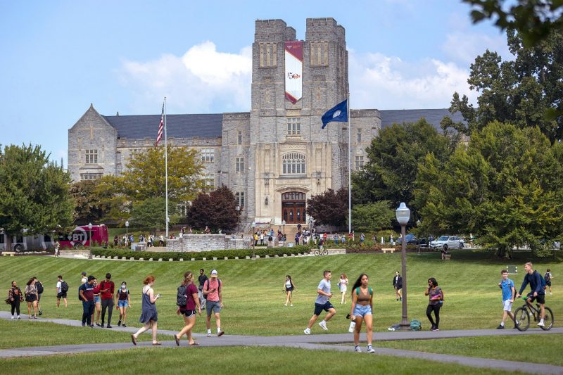 Students cross the Drillfield during the first day of classes, fall 2021. 