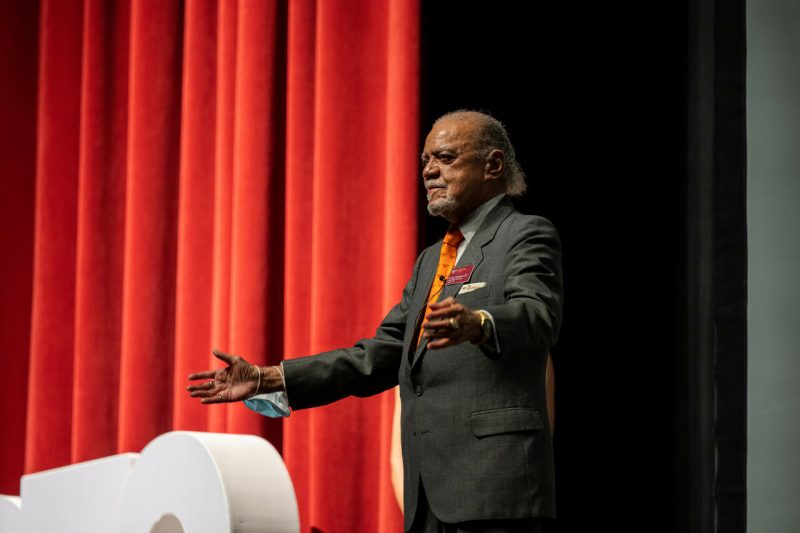 Irving Peddrew speaking on a stage