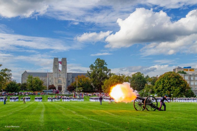 cannon firing on Drillfield in front of Burruss