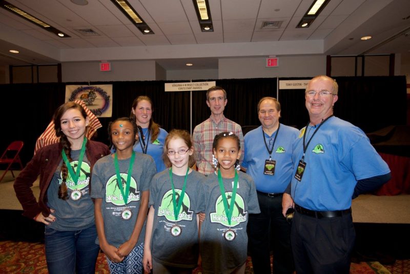Mike Weaver posing with 4-H insect collection award winners in 2016.