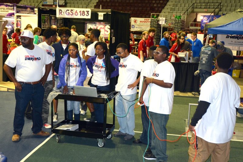 Delta Overload team members await their turn at the For Inspiration and Recognition of Science and Technology (FIRST) robotics competition.