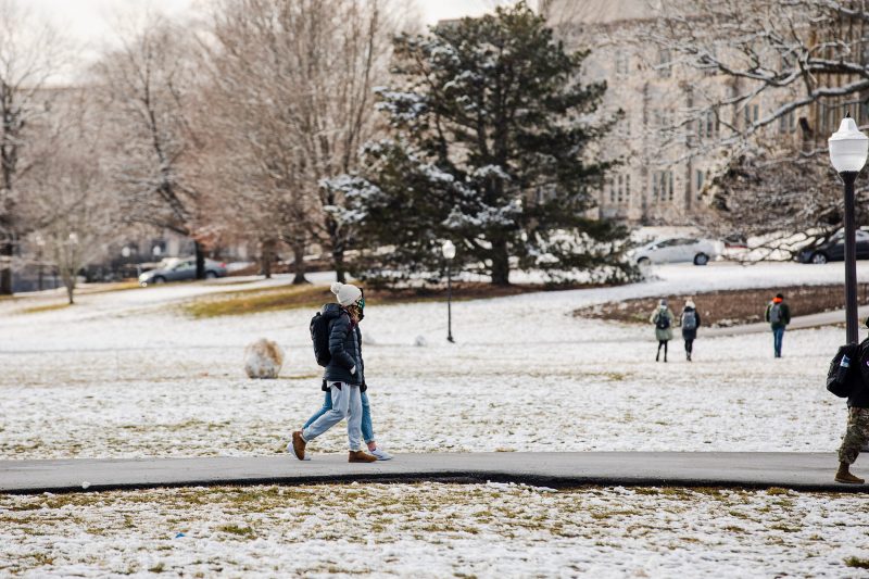 Students cross the Drillfield